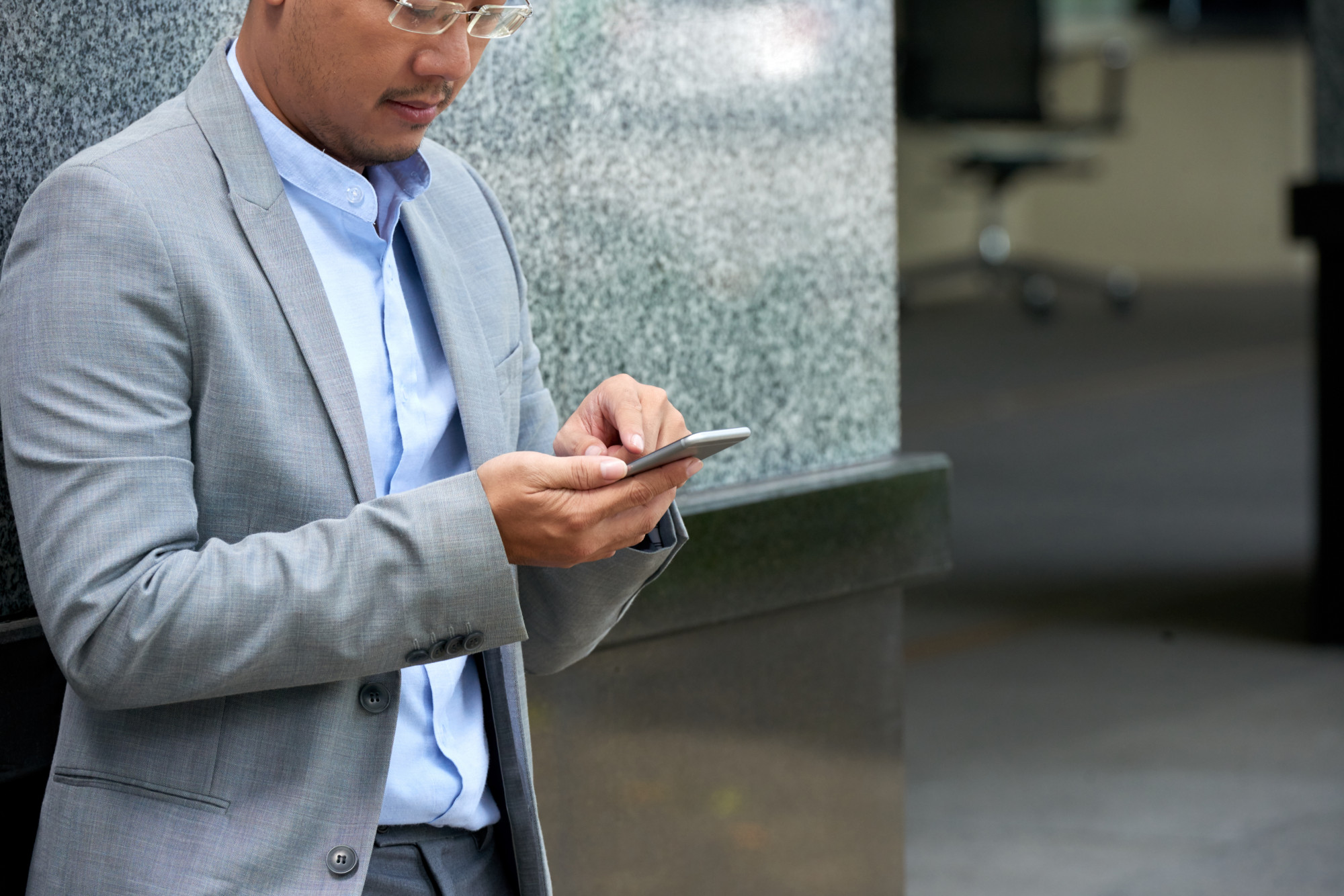 business man texting from phone