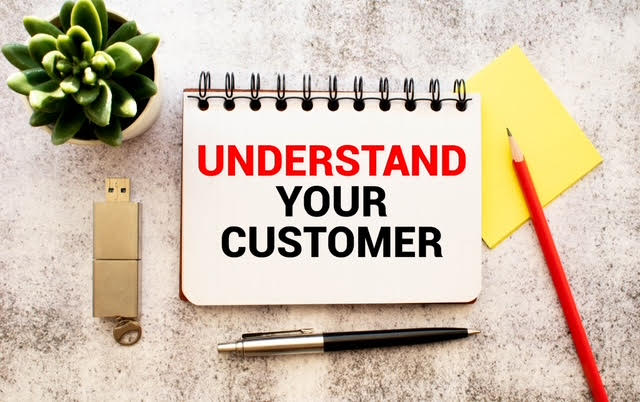 A spiral-bound pad with Understand Your Customer written on it